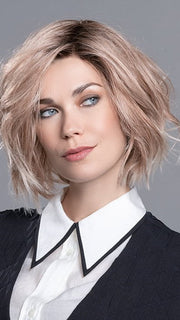 This bold bob features  an edgy razor finish