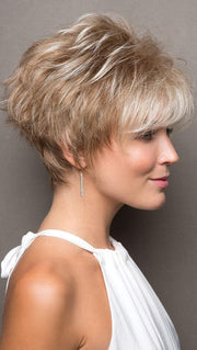 Bold multi-layered style is full of texture and hugs the nape with tapered edges.