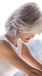 This style is a long bob cut with layers around the face for a flattering and natural look