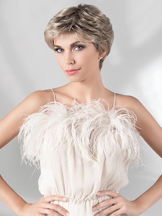  With a light density, style the wispy bangs off the face for a different look