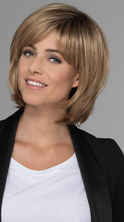 The Heather Wig by Estetica features a smooth side swept bang to top off this glamorous cut