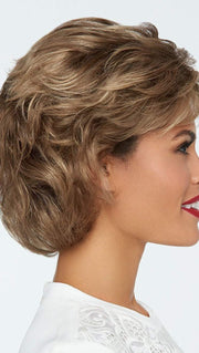 This textured, wavy style features all over layers, soft body and curls. 