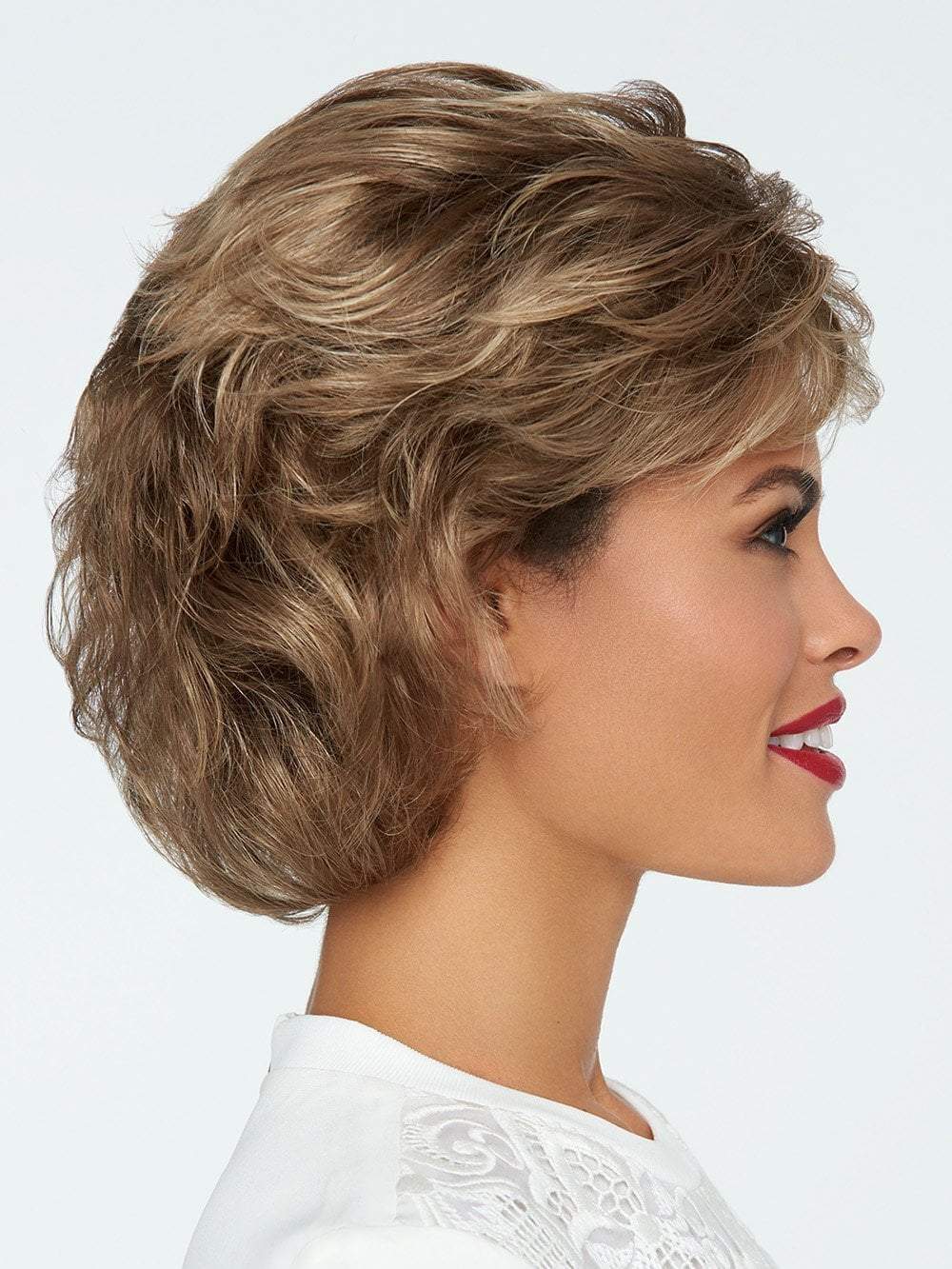 This textured, wavy style features all over layers, soft body and curls. 