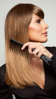 We recommend the Hair Trix Comb by BeautiMark to keep your hair detangled and frizz free (style shown is Lucy by Revlon).