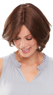 Worn over the part and adds volume to short styles