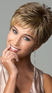 Wispy, feathered bangs for no fuss styling | Color: Brown Blonde