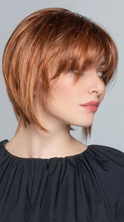 The slightly longer than chin length and face-framing layers create a sleeky, edgy look