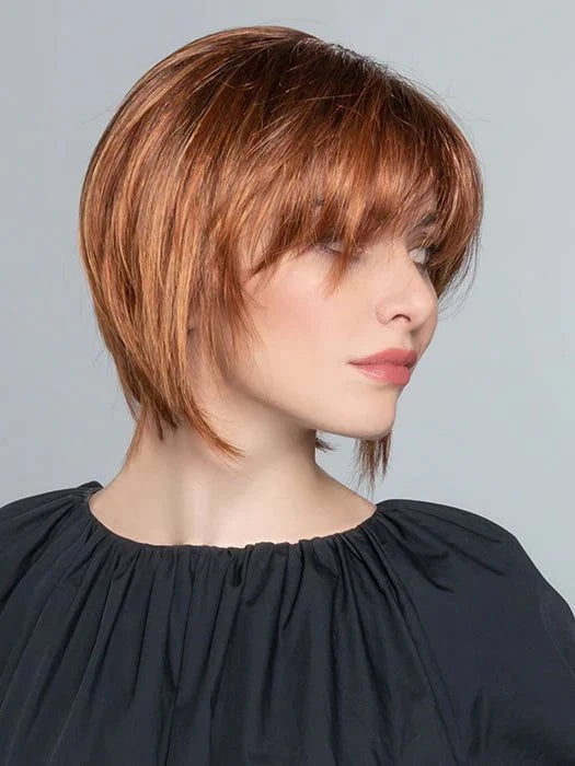 The slightly longer than chin length and face-framing layers create a sleeky, edgy look
