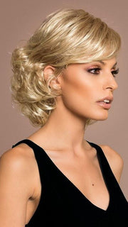 Styled brushed smooth on the top and behind the ear