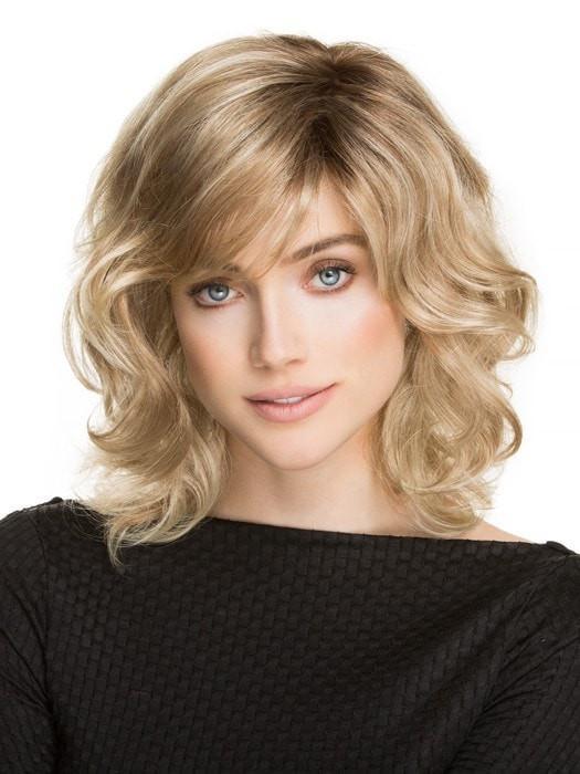 A voluminous, shoulder-length wig with a wavy texture all over