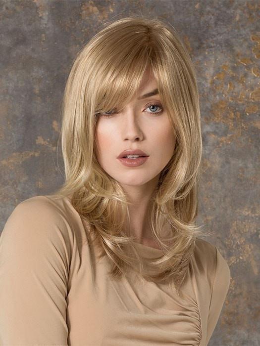 Smooth and straight with a soft side bang and wispy, flipped ends