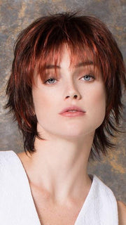 Modern cut with bangs and fashion forward colors 