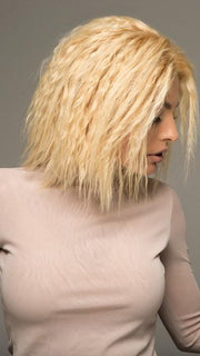 Styled with a tight kinky curl