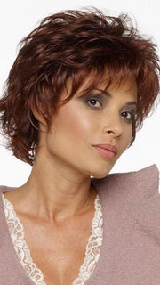 Alyssa Petite is a fashion forward layered shag with bangs