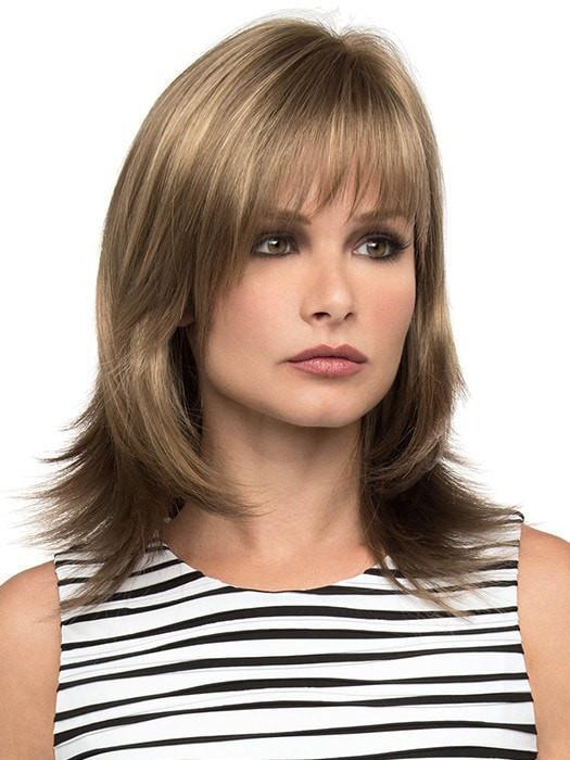Features long layers and wispy face framing bangs | Color: Almond Breeze