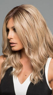 Longer fringe around the face that compliments the tight curls and subtle layers (This piece has been styled and curled)