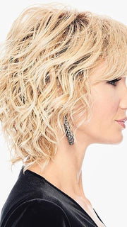 The softly waved crown and fringe blend to spiral tendrils that are light and airy
