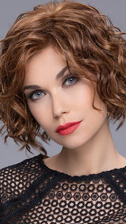 Turn is an ultra-gorgeous, mid-length style full of curls throughout