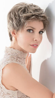 This short synthetic style has an extended lace front, which gives the appearance of a beautifully natural hairline