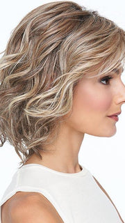 A gently waved and tousled layered bob that offers even more styling versatility with 100% hand-tied cap