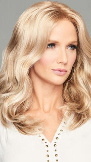 Luscious shoulder-length style features gentle waves that tumble loosely for loads of movement