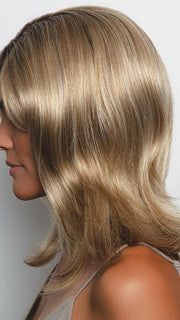 A long layered wavy style with a monofilament top that can be styled and adjusted to fit any mood