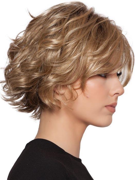A short-layered style with soft curls and a long off-center bang