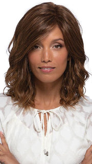 Loose waves fall below the shoulder