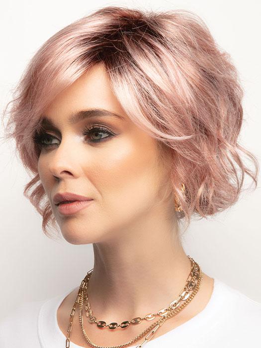 A chin length textured bob with trendy, side swept fringe