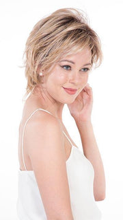 A face flattering bob with feathered layers and wispy ends creates razor-end pieces around the face.