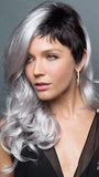 Long, loose  waves accentuated by a short, chic cut on left side. | Color: Illumina-R Violet Silver with Dark Roots.