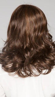 Lovely layers all over create cascading curls | Color: Toasted Brown