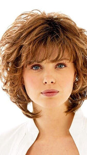 A wavy style with a wispy bang and built-in volume that gives you nice lift at the root