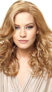 Heat-Friendly synthetic fiber, styled curly in this photo. Shown in RL14/25 HONEY GINGER | Dark Blonde Evenly Blended with Medium Golden Blonde
